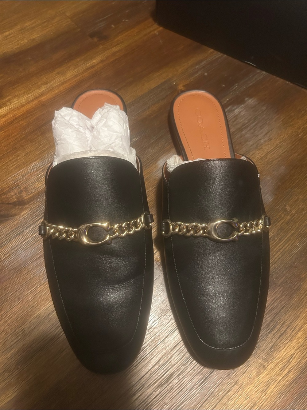 Coach Black Leather Mules with Gold Chain Accent
